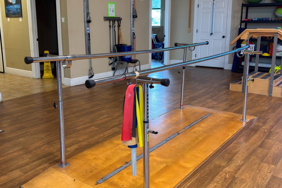 Parallel bars used for walking and balance training after surgery at Castroville Physical Therapy