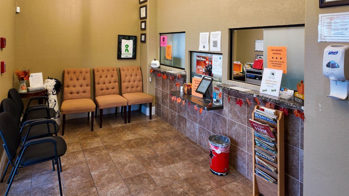 Front lobby waiting area and check in windows at Castroville Physical Therapy & Sport Rehabilitation