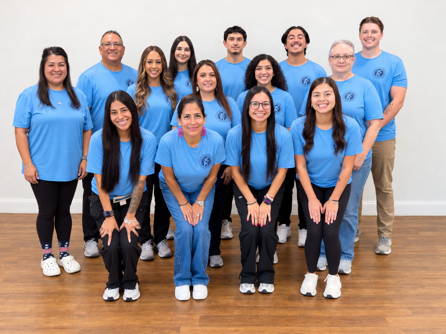 The full Castroville Physical Therapy team in matching blue clinic shirts
